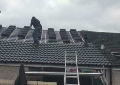 man working on a roof in glasgow