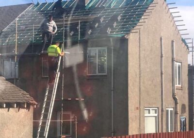 property maintenance team working on roofing a home in glasgow