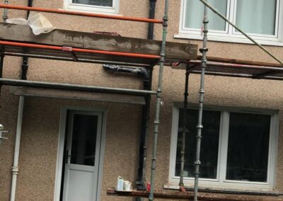 scaffolding outside a house that is getting roughcasting